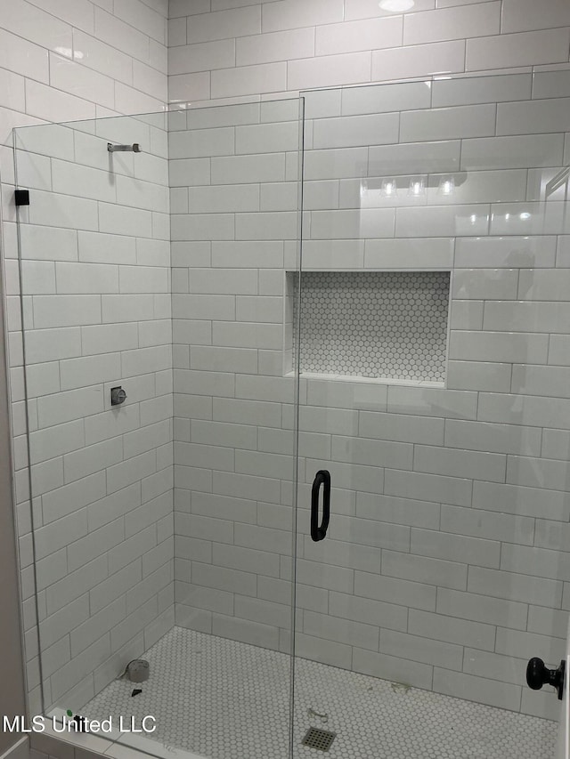 full bathroom featuring a shower stall