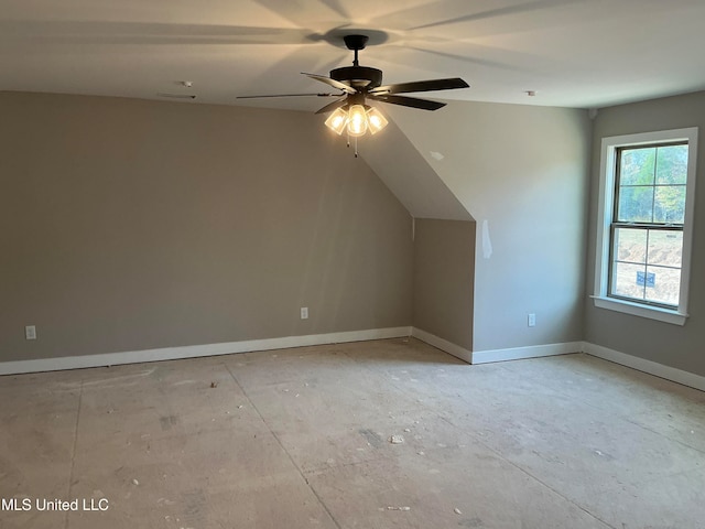 bonus room with a ceiling fan, vaulted ceiling, and baseboards