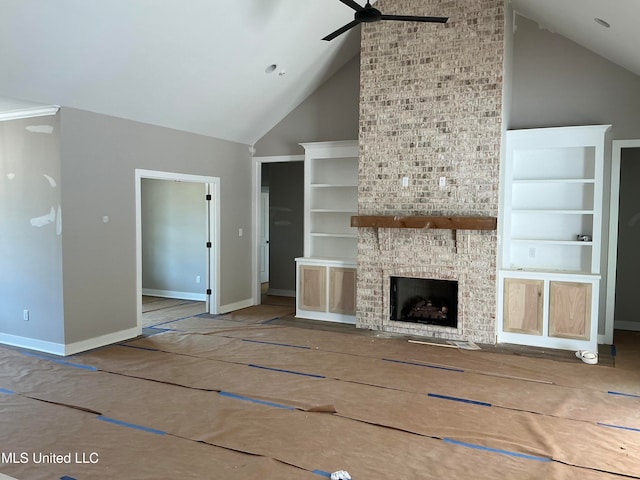 unfurnished living room featuring high vaulted ceiling, a fireplace, a ceiling fan, built in features, and baseboards