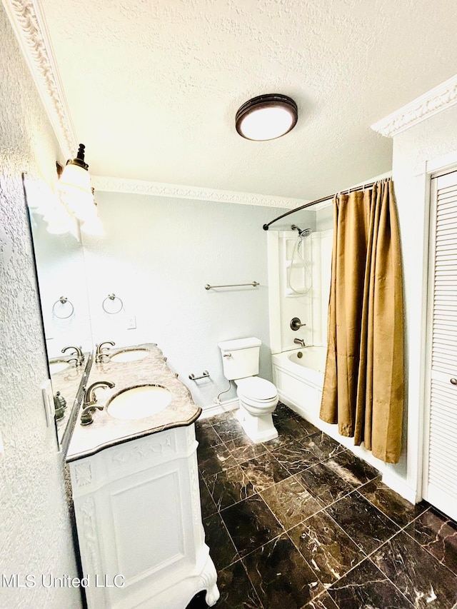 full bathroom featuring toilet, a textured ceiling, shower / bath combo, and vanity