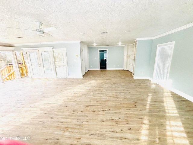 unfurnished living room with ornamental molding, light hardwood / wood-style flooring, a textured ceiling, and ceiling fan