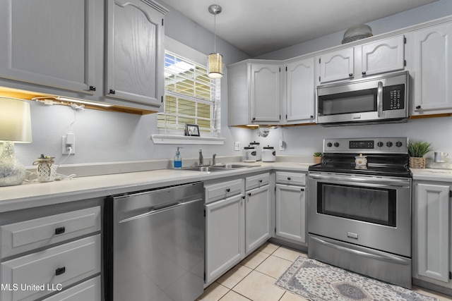13625 Mount Pleasant Rd, Vancleave, MS 39565 - kitchen featuring stainless steel appliances, light countertops, pendant lighting, and light tile patterned floors