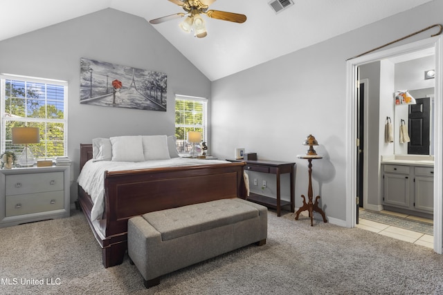 13625 Mount Pleasant Rd, Vancleave, MS 39565 - bedroom featuring light carpet, lofted ceiling, ensuite bath, a ceiling fan, and light tile patterned flooring