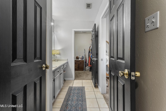 13625 Mount Pleasant Rd, Vancleave, MS 39565 - bathroom with vanity and tile patterned flooring
