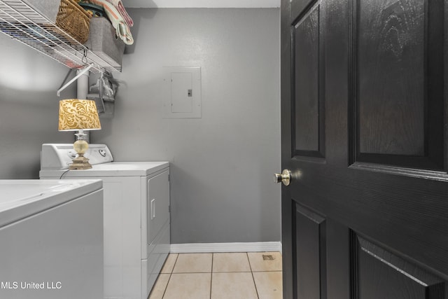 13625 Mount Pleasant Rd, Vancleave, MS 39565 - laundry room featuring electric panel, washing machine and dryer, and light tile patterned floors
