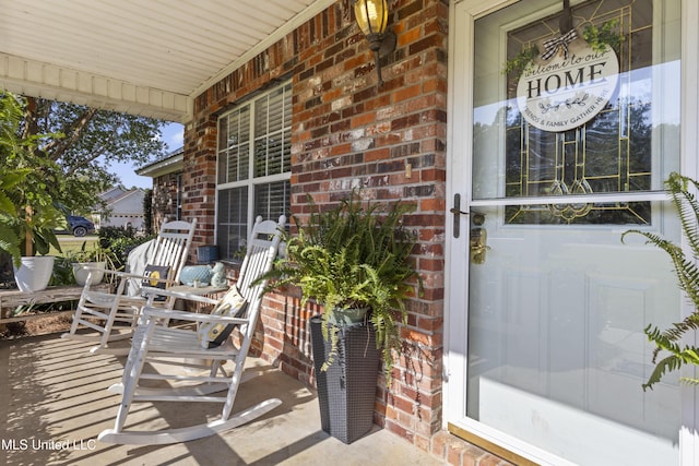 13625 Mount Pleasant Rd, Vancleave, MS 39565 - view of exterior entry with covered porch and brick siding