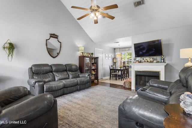 13625 Mount Pleasant Rd, Vancleave, MS 39565 - living area featuring a ceiling fan, vaulted ceiling, wood finished floors, and a fireplace