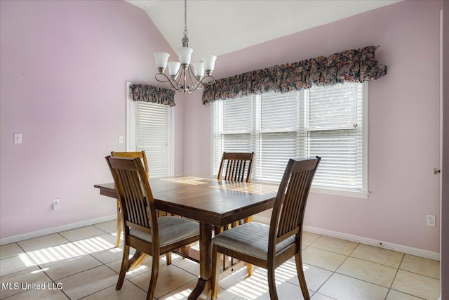 dining room featuring an inviting chandelier, baseboards, lofted ceiling, and light tile patterned flooring