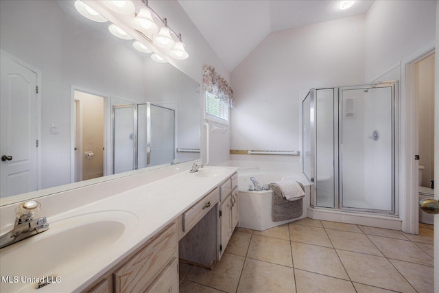 full bath with high vaulted ceiling, a shower stall, a sink, and a garden tub