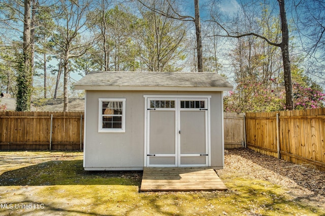 view of shed featuring a fenced backyard