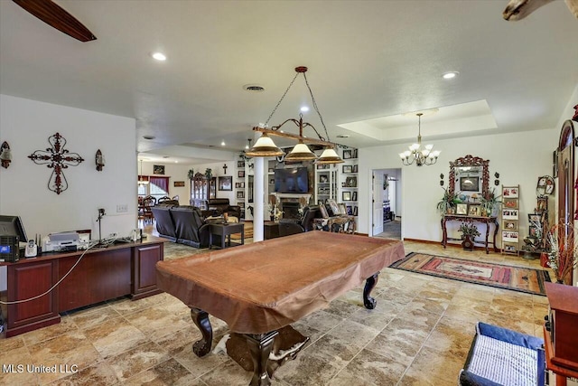 recreation room with billiards and a raised ceiling