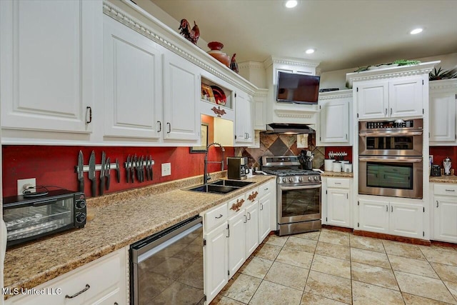 kitchen with white cabinetry, appliances with stainless steel finishes, and sink