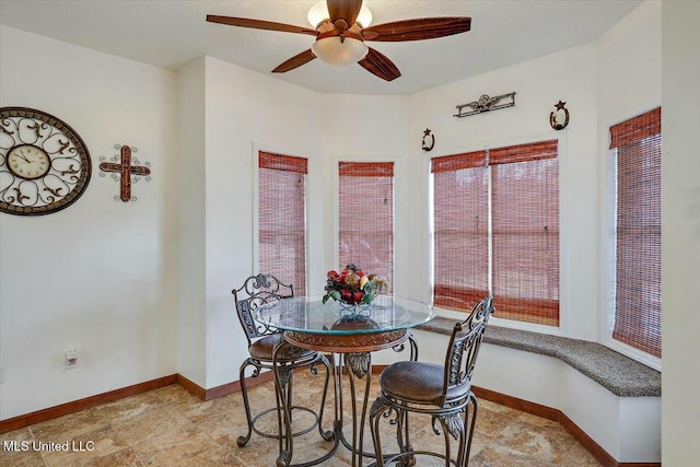 dining room featuring ceiling fan