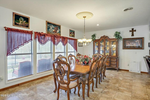 dining room featuring a chandelier