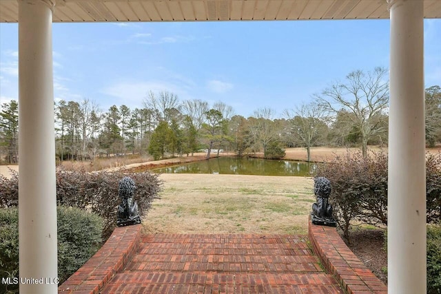 view of patio / terrace with a water view