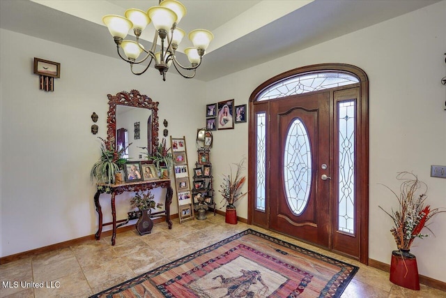 foyer entrance with a chandelier