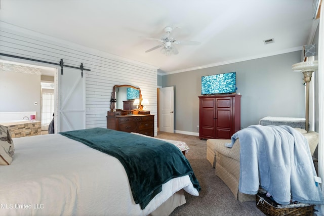 carpeted bedroom with crown molding, a barn door, ceiling fan, and ensuite bathroom