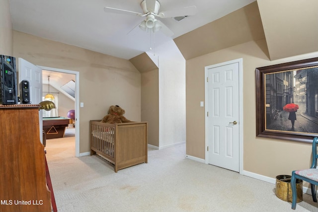 interior space with light carpet, lofted ceiling, and ceiling fan