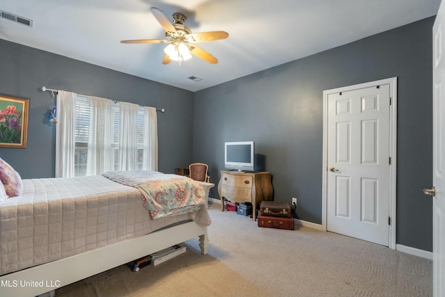 bedroom featuring ceiling fan and light colored carpet