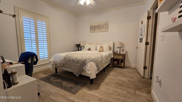 312 Grandview Ct, Pearl, MS 39208 - bedroom with crown molding, wood finished floors, baseboards, and a ceiling fan
