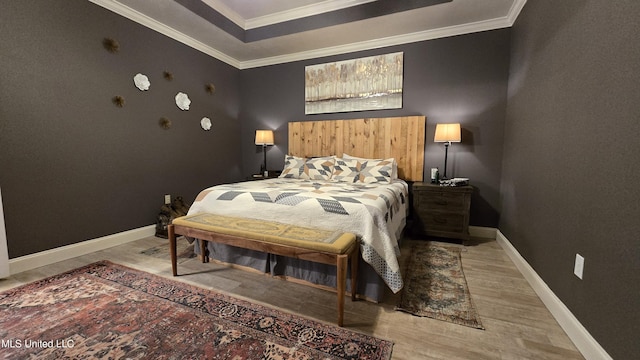 312 Grandview Ct, Pearl, MS 39208 - bedroom featuring light wood-type flooring, ornamental molding, baseboards, and a raised ceiling