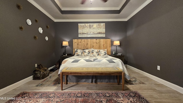 312 Grandview Ct, Pearl, MS 39208 - bedroom featuring a raised ceiling, wood finished floors, baseboards, and crown molding