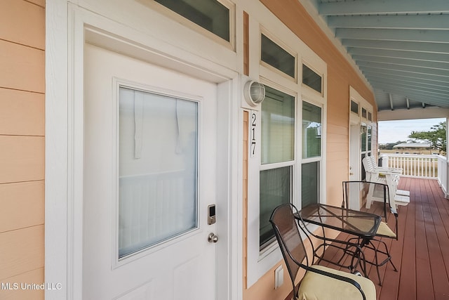 wooden terrace featuring a porch