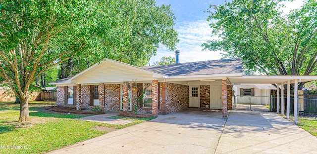 single story home with a front yard and a carport