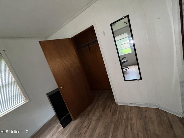 99 SW Railroad Rd, Roxie, MS 39661 - unfurnished bedroom featuring wood finished floors, a closet, and vaulted ceiling