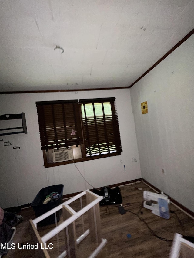 99 SW Railroad Rd, Roxie, MS 39661 - spare room with wood finished floors, ornamental molding, and cooling unit