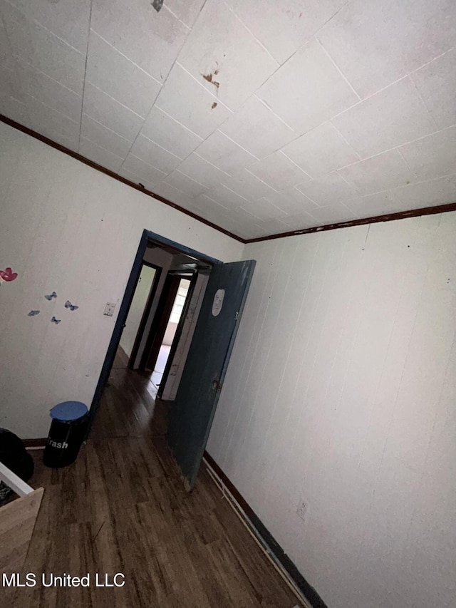 99 SW Railroad Rd, Roxie, MS 39661 - unfurnished room with wood finished floors, ornamental molding, and wooden walls