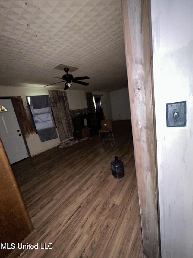 99 SW Railroad Rd, Roxie, MS 39661 - unfurnished living room featuring wood finished floors and a ceiling fan