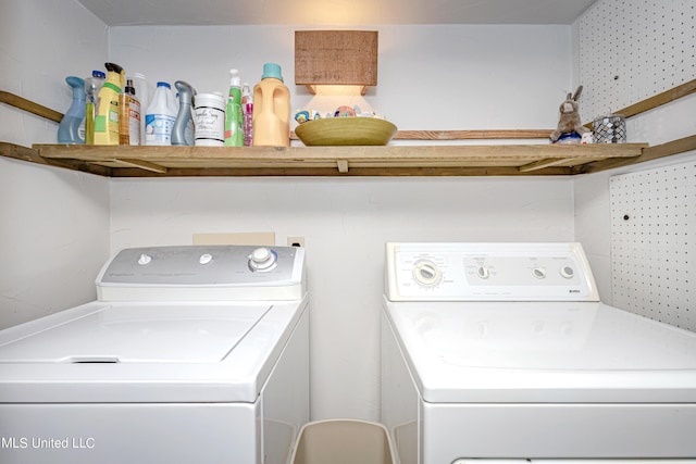 clothes washing area with washing machine and clothes dryer