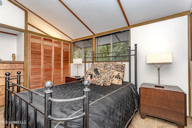 bedroom featuring vaulted ceiling