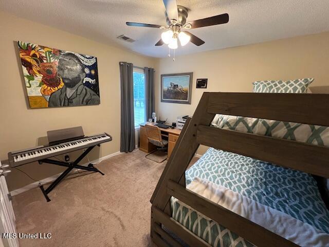 211 Fairway Trace Dr, Hernando, MS 38632 - bedroom featuring carpet floors, a textured ceiling, a desk, baseboards, and ceiling fan