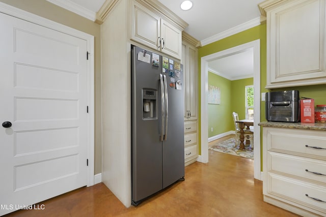 kitchen featuring crown molding, stainless steel fridge with ice dispenser, light stone counters, and cream cabinetry