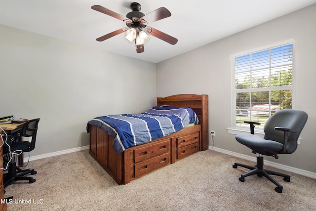 bedroom with ceiling fan and light carpet