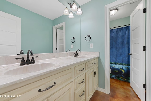 bathroom featuring vanity and concrete floors