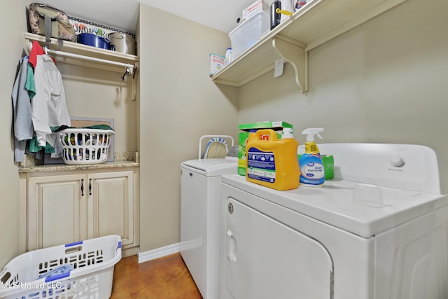 clothes washing area with separate washer and dryer