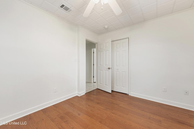 spare room featuring ceiling fan and wood-type flooring