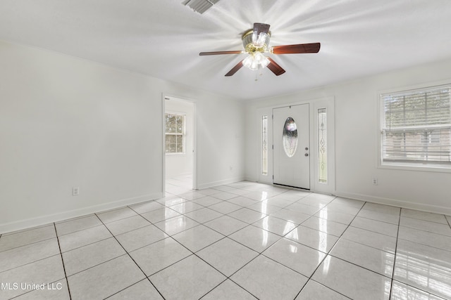 tiled entrance foyer with ceiling fan