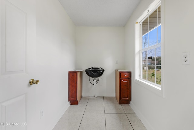 washroom with light tile patterned flooring