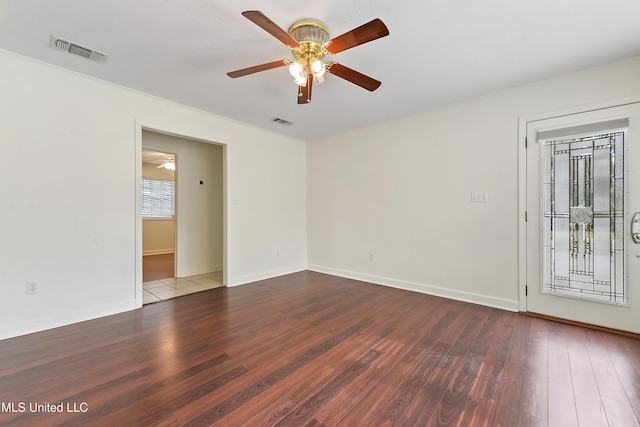 empty room with ceiling fan and wood-type flooring