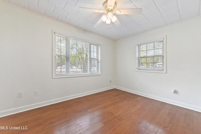 unfurnished room with ceiling fan and hardwood / wood-style floors