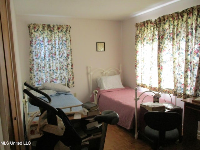 bedroom featuring parquet floors