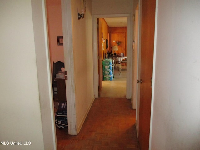 hallway with dark parquet floors