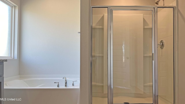 112 Mulberry Dr, Lucedale, MS 39452 - bathroom featuring a stall shower and a garden tub