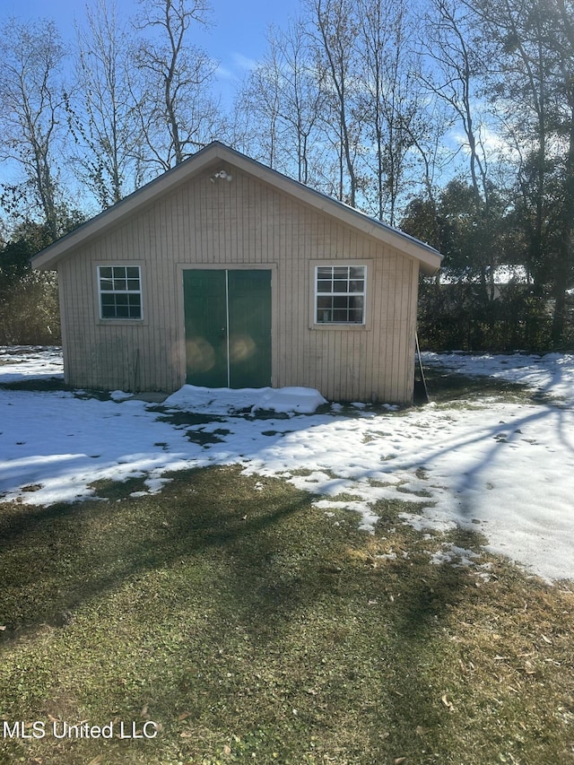 view of snow covered garage