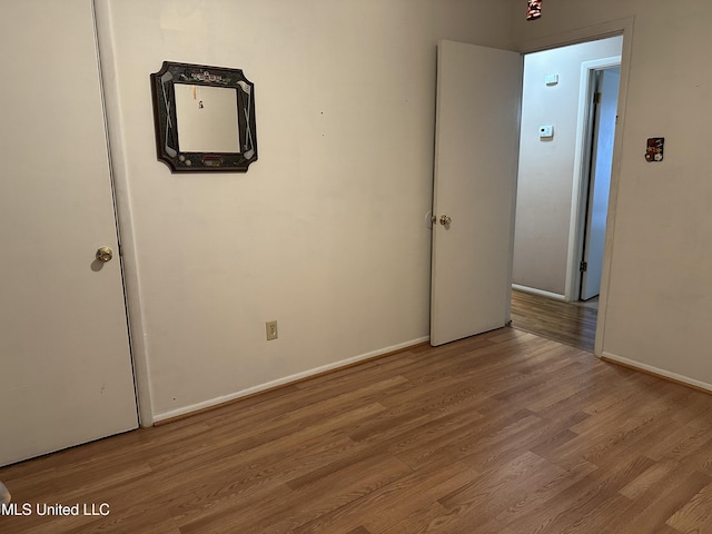 unfurnished room with light hardwood / wood-style flooring