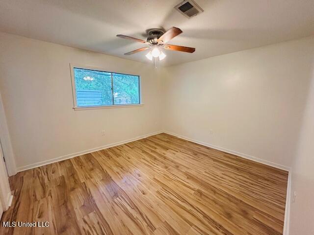 810 Louis Wilson Dr, Brandon, MS 39042 - spare room with light wood finished floors, a ceiling fan, and baseboards